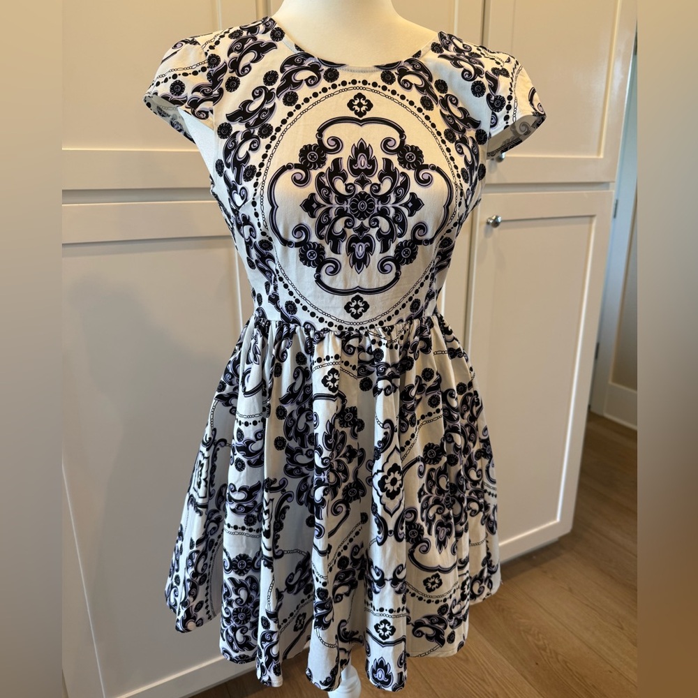 Women’s mini dress size small in a fit and flare feminine style with cap sleeves